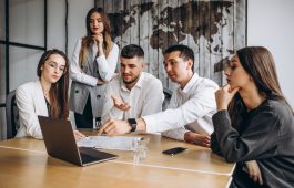 Group of people working out business plan in an office