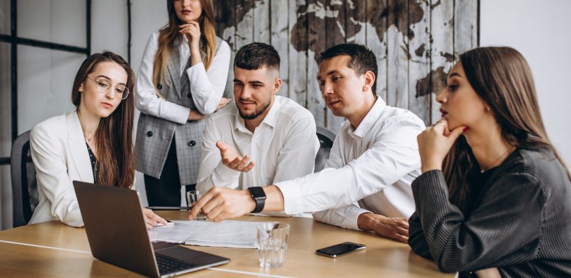 Group of people working out business plan in an office